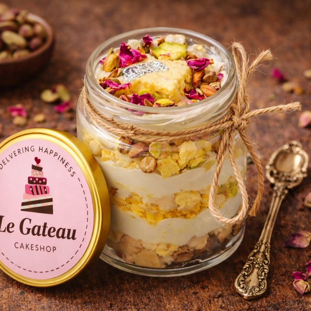 Le Gateau Cakeshop dessert in a jar with decorative elements on a rustic background